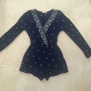 Cute long sleeved v-neck romper by Chloe & Katie!